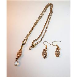 17)  GOLD TONE WITH WHITE CRYSTAL