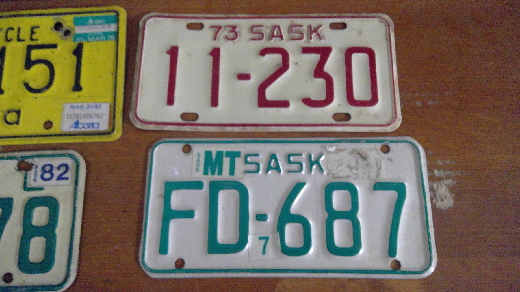 FOUR MOTORCYCLE PLATES SASKATCHEWAN AND ALBERTA Schmalz Auctions