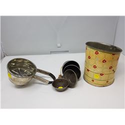 TWO KITCHEN SIFTERS AND MEASURING CUPS