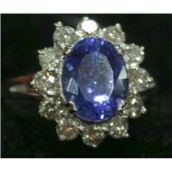 42) 14K WHITE GOLD TANZANITE AND DIAMOND RING,