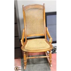 WOOD AND WICKER ROCKING CHAIR.