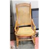 Image 1 : WOOD AND WICKER ROCKING CHAIR.