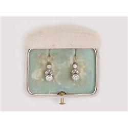 A Pair of Earrings in its Case           