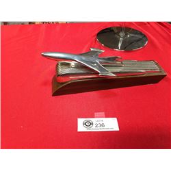 A Hood Ornament Mounted on a Decorative Piece of Wood. Very Attractive Looking
