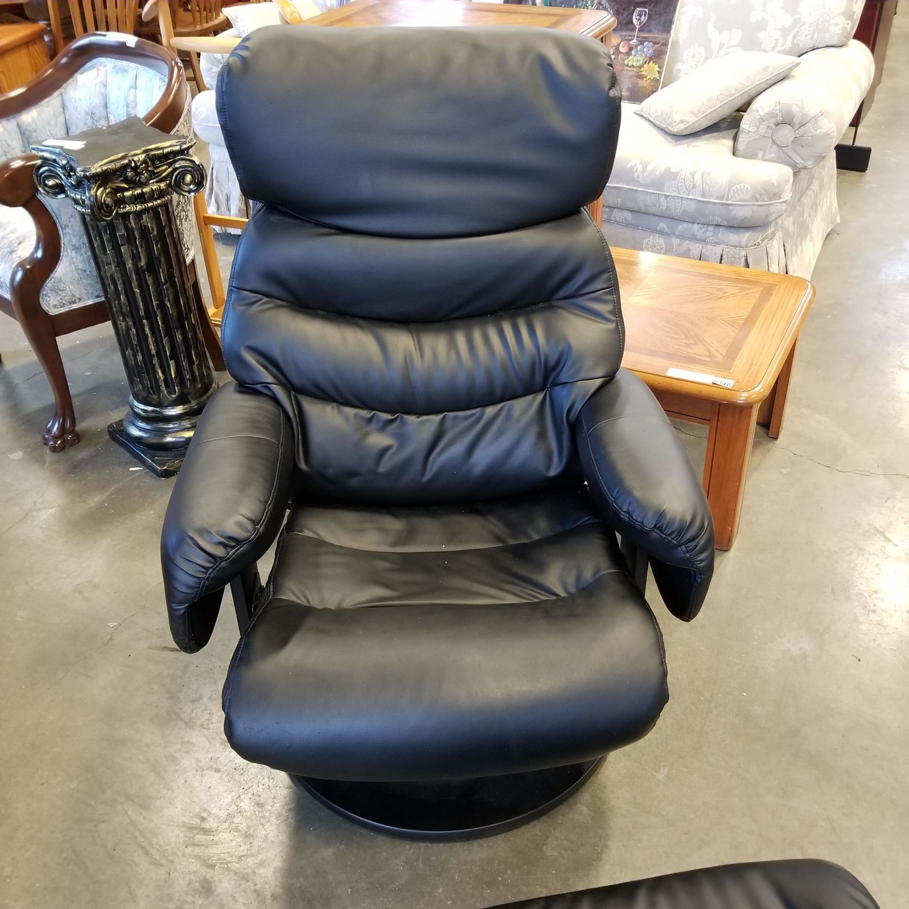 BLACK LEATHER SWIVEL CHAIR AND FOOTSTOOL - Big Valley Auction