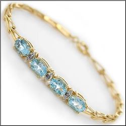 Plated 18KT Yellow Gold 5.29ctw Blue Topaz and Diamond Bracelet