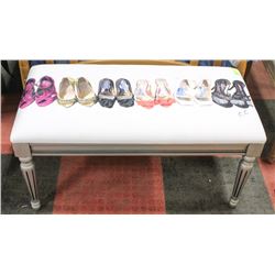 WHITE FABRIC BENCH WITH SHOE DESIGN ON IT,