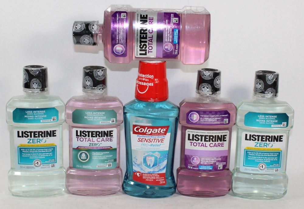 BAG OF ASSORTED COLGATE AND LISTERINE MOUTHWASHES