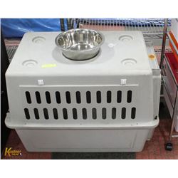 LARGE PET KENNEL WITH WATER/FOOD DISH.