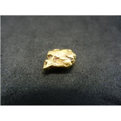 1.06 grams gold nugget high Karat