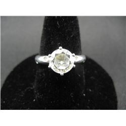 Ladies sterling ring size 8 with cubic zirconia stone and small stones in band.