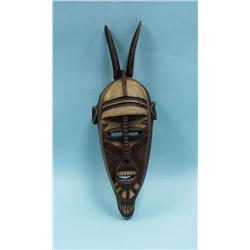 A well carved and hand painted African tribal mas