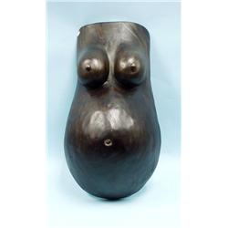An unusual hand carved African wood torso of a pr