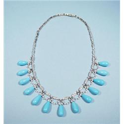 An 18 kt. white gold, diamond and turquoise fring