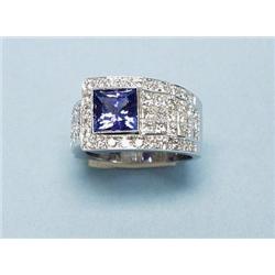 An 18 kt. white gold and diamond band ring set wi