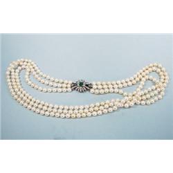 A 26" long triple stranded cultured pearl necklac