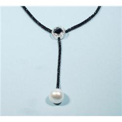 An exceptional black diamond and pearl necklace b