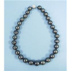 A fine Tahitian black pearl necklace, graduated i