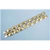 Image 1 : A wide 18 kt. three tone gold bracelet designed o