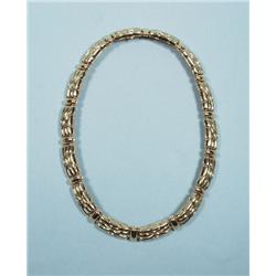 BOUCHERON, FRANCE - A heavy 18 kt. yellow gold ne