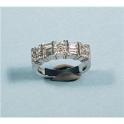 A good 18 kt. white gold and diamond band ring al