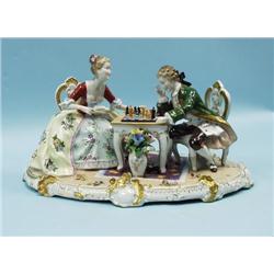 A decorative German porcelain figural group depic