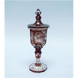 An antique Bohemian ruby glass covered cup. The f