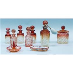 A 9 piece French Baccarat ruby crystal toilet set