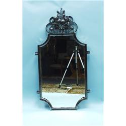 An unusual French wrought iron framed wall mirror