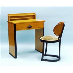 A walnut and black lacquer finished small desk wi