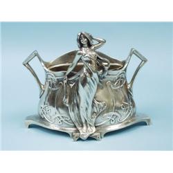 ART NOUVEAU - W. HERRING. A silver patinated bron