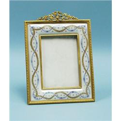 An antique French gilt bronze easel picture frame