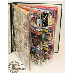 BINDER OF PRO SET HOCKEY CARDS.