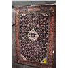 Image 1 : 100% wool Hossien Abad carpet with center medallion, dark blue background and highlights of pink, ta