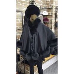 Courtesy of Muscalus Furs a Beautiful Black Cashmere Cape with Fox Trim