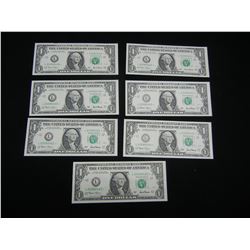 (7) 2001 $1 Federal Reserve * (Replacement) Notes.  Consecutive serial #'s