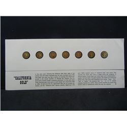 7 Cal Gold Tokens in holder