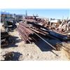 Image 1 : Rack of drill steel, about 100.  Round and octagon, 1 1/2 in dia.  Mostly 12 ft lengths  (114181)