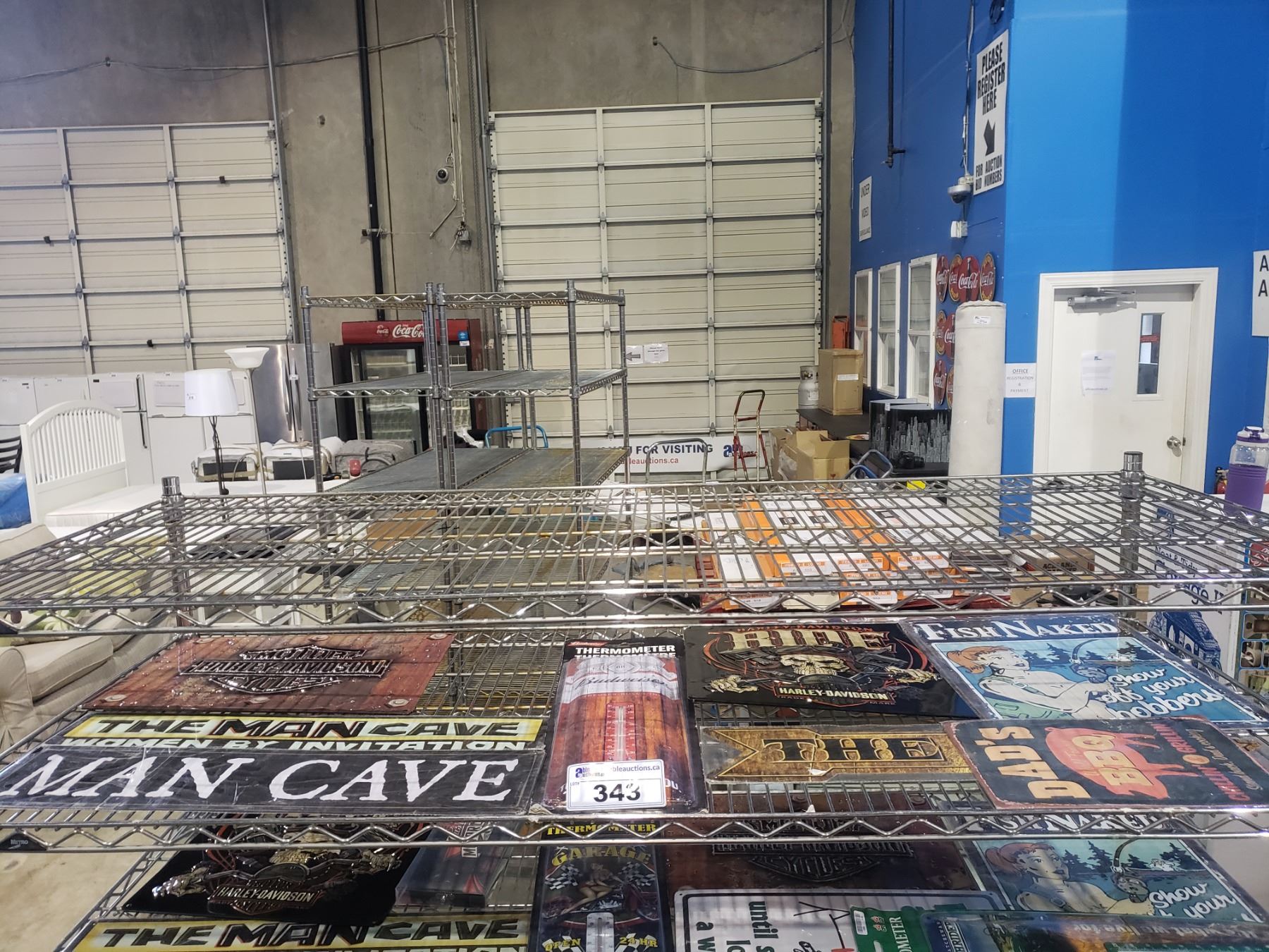 SHELF OF ASSORTED SIGNS