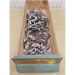wooden drawer full of hooks #2