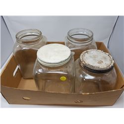 FOUR GLASS JARS (2 WITH LIDS)