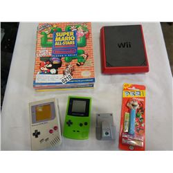 6 NINTENDO PLAYERS GUIDES AND GAMEBOY COLOUR W/ DONKEY KONG GAME, GAMEBOY, N64 RUMBLE, WII, AND PEZ 