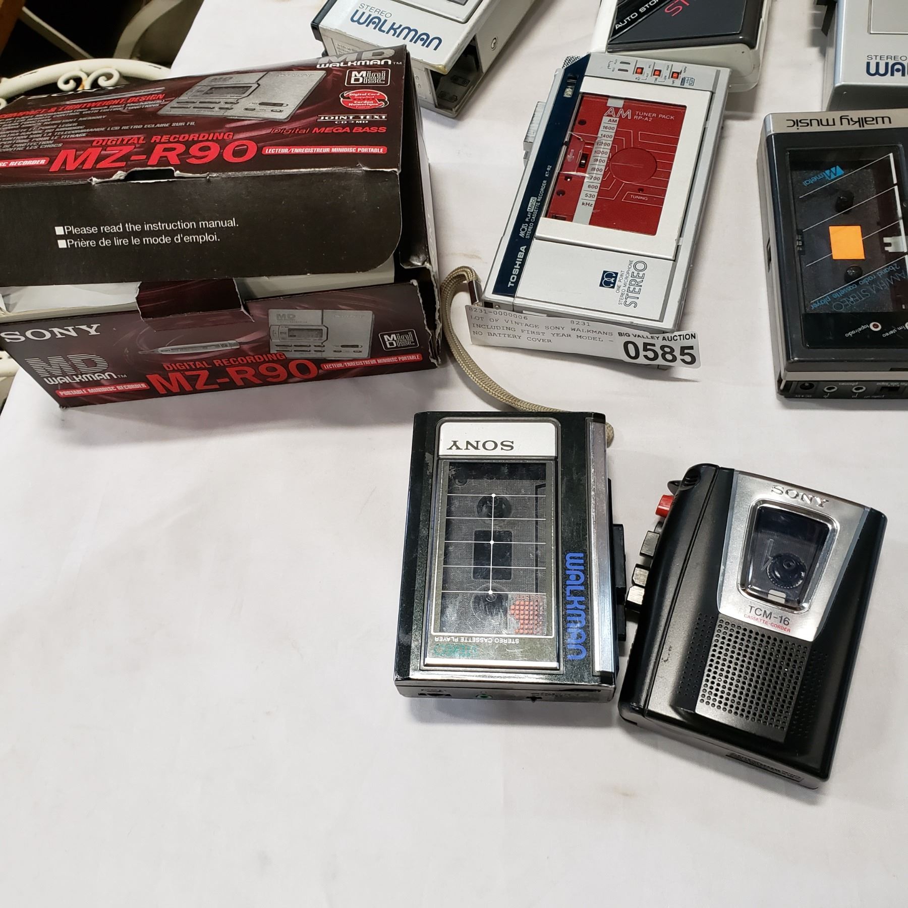 Six vintage Sony Walkmans and a digital audio tape recorder Six vintage Sony Walkmans and a digital audio tape recorder