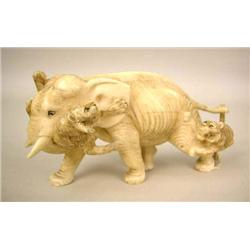 A JAPANESE IVORY CARVING OF TWO TIGERS 