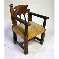 A BAROQUE WALNUT ARMCHAIRProbably Itali