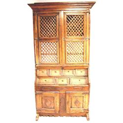 A BAROQUE WALNUT SECRETARY BOOKCASEItal