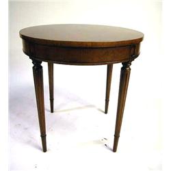 A LOUIS XVI STYLE WALNUT CIRCULAR LOW T