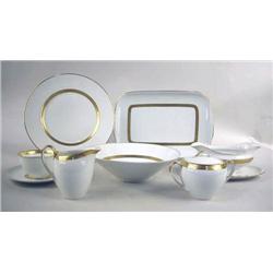 A WHITE AND PARCEL GILT PORCELAIN DINNE