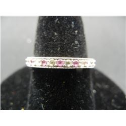 Ladies sterling band size 7 with white and pink GRM tested stones.