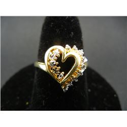 Ladies sterling ring size 5 ¾.  Gold toned, heart design, with small tested diamonds.
